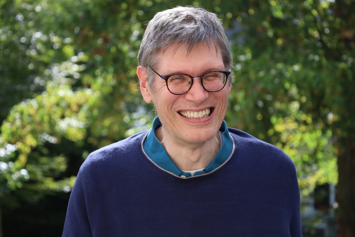 Karsten H. Weylandt laughing in the garden of the International House.